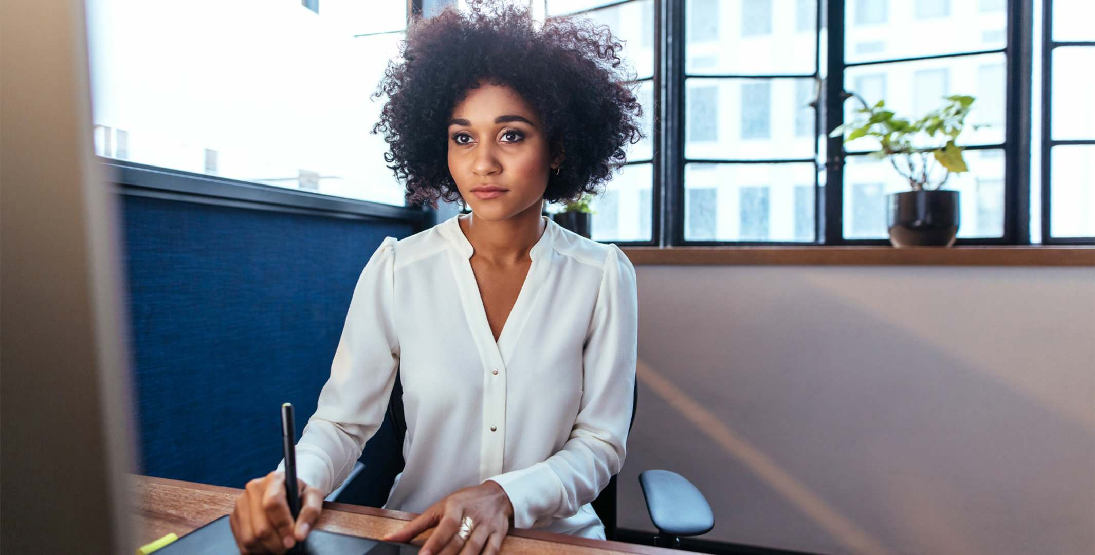 Female Graphic Design worker at computer