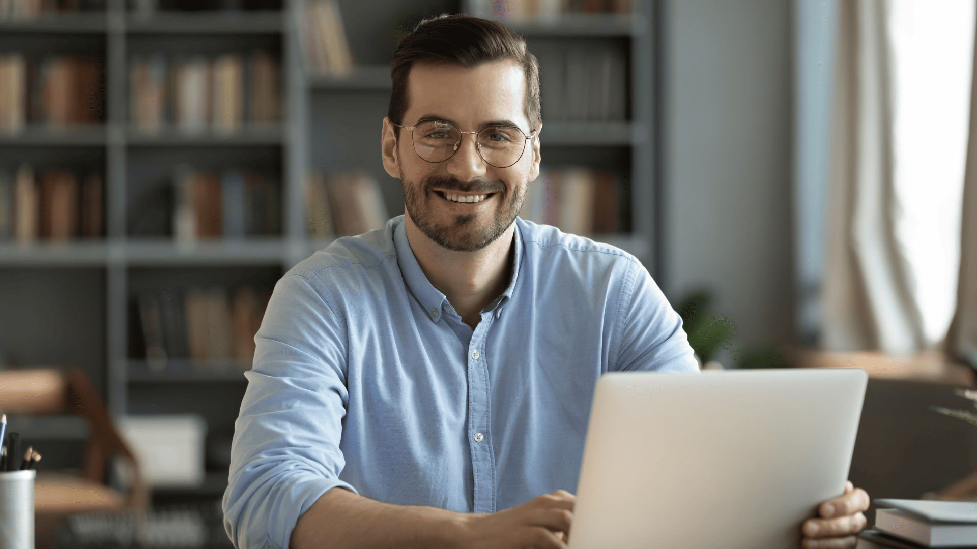 man at desk with a computer